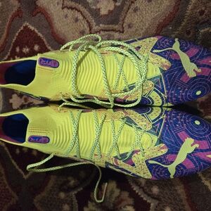 Vibrant Yellow and Purple Soccer Cleats